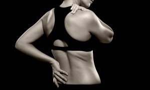 Patient touching neck and hips.