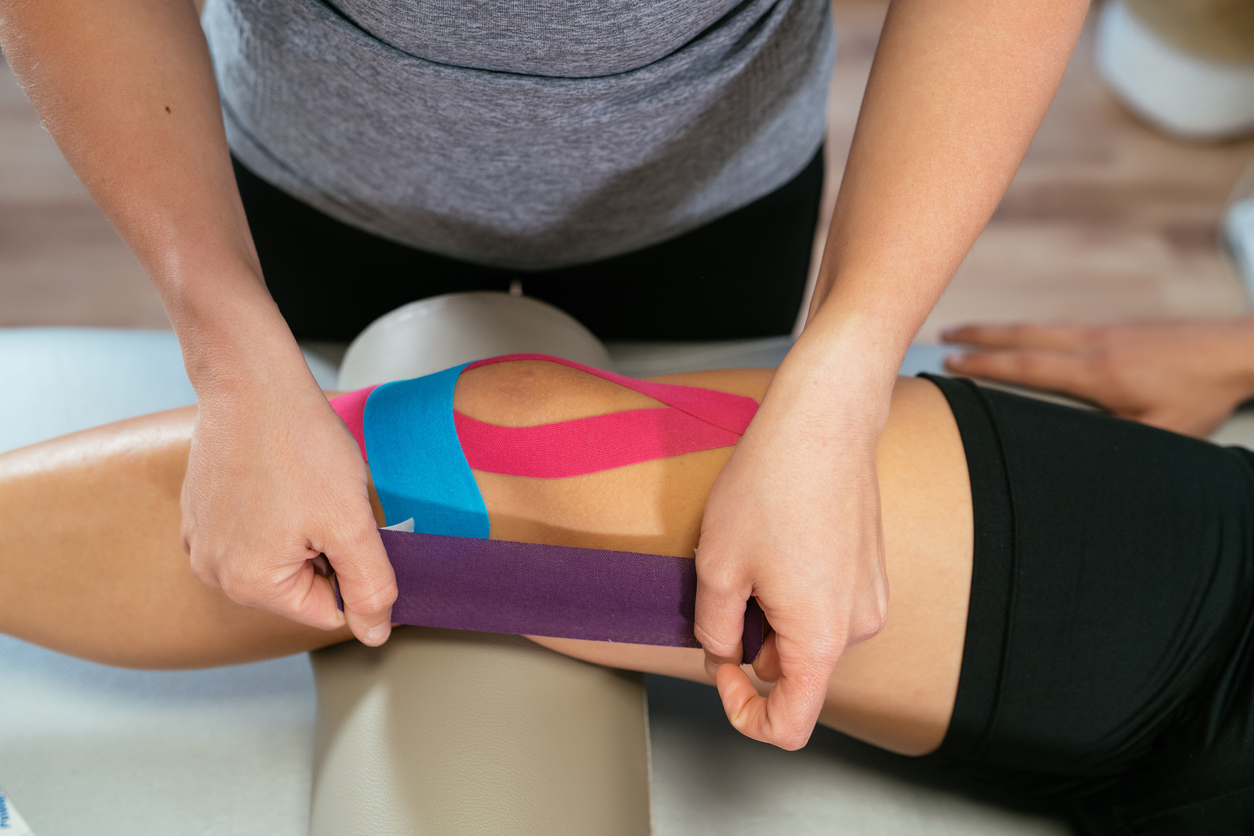Client holding knee